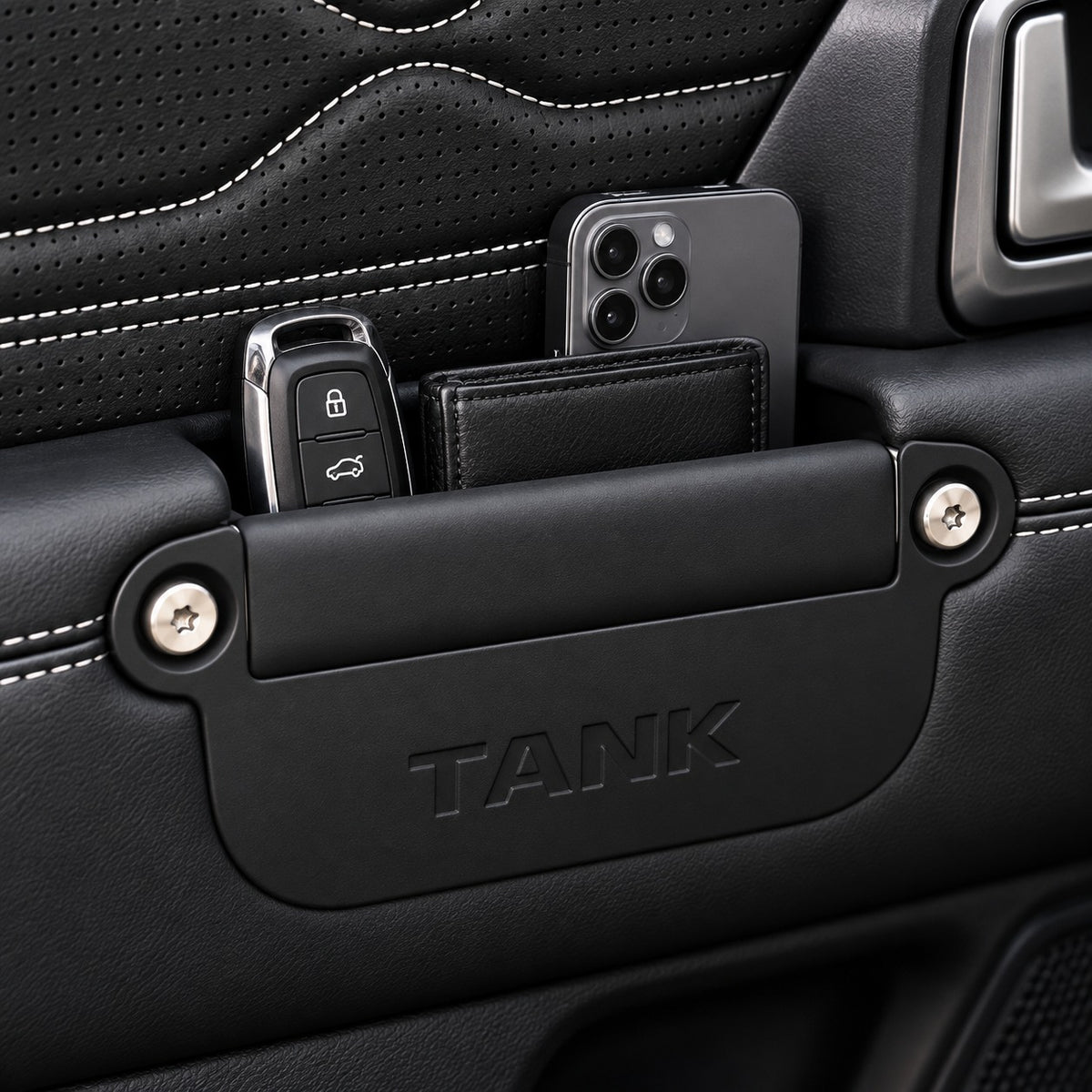 Great Wall Tank 300 black door handle storage box installed inside the car door, holding a smartphone, wallet, and car key.