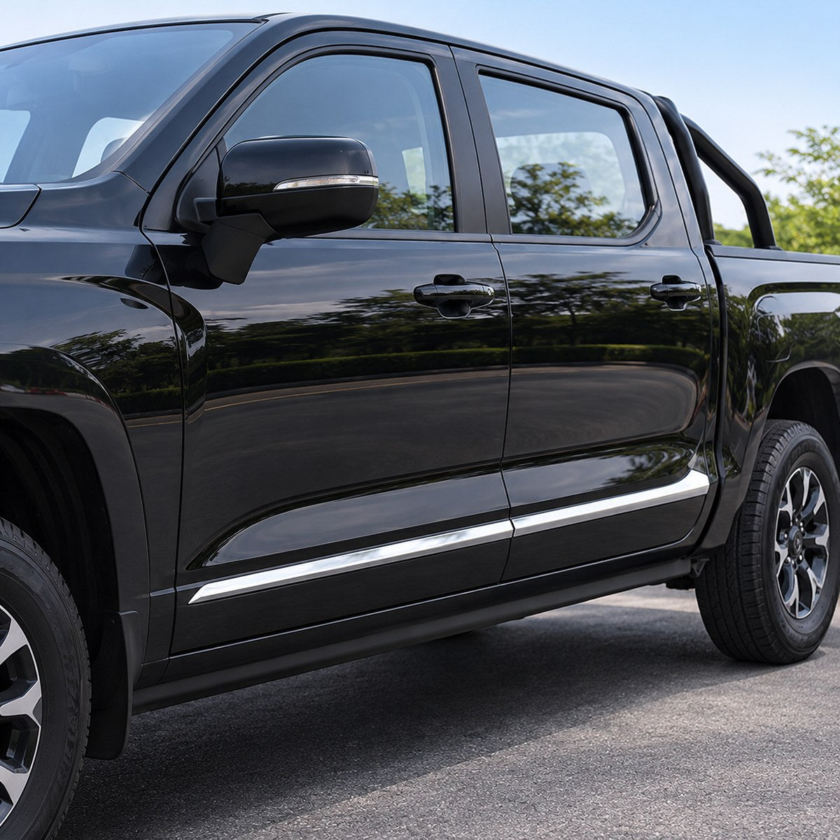 Angled view of GWM Cannon King Kong with stainless steel side door trim installed, highlighting the polished finish and door panel detailing.