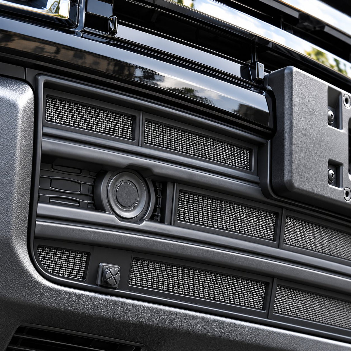 Close-up of GWM Haval H9 black insect screen grille mesh texture after installation