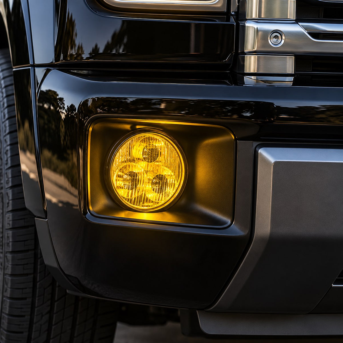Close-up of illuminated yellow fog lamp installed on GWM Haval H9