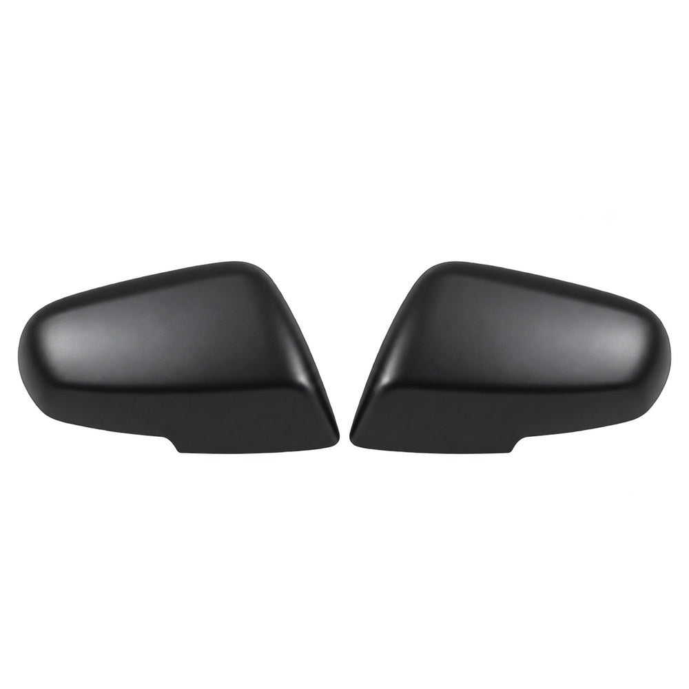 Pair of matte black automotive side mirror covers with smooth surfaces.