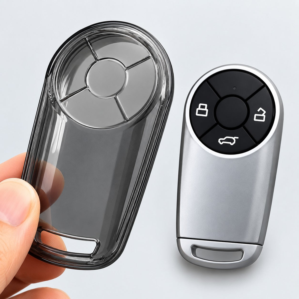 GWM ORA TPU key case cover and silver car key fob displayed together