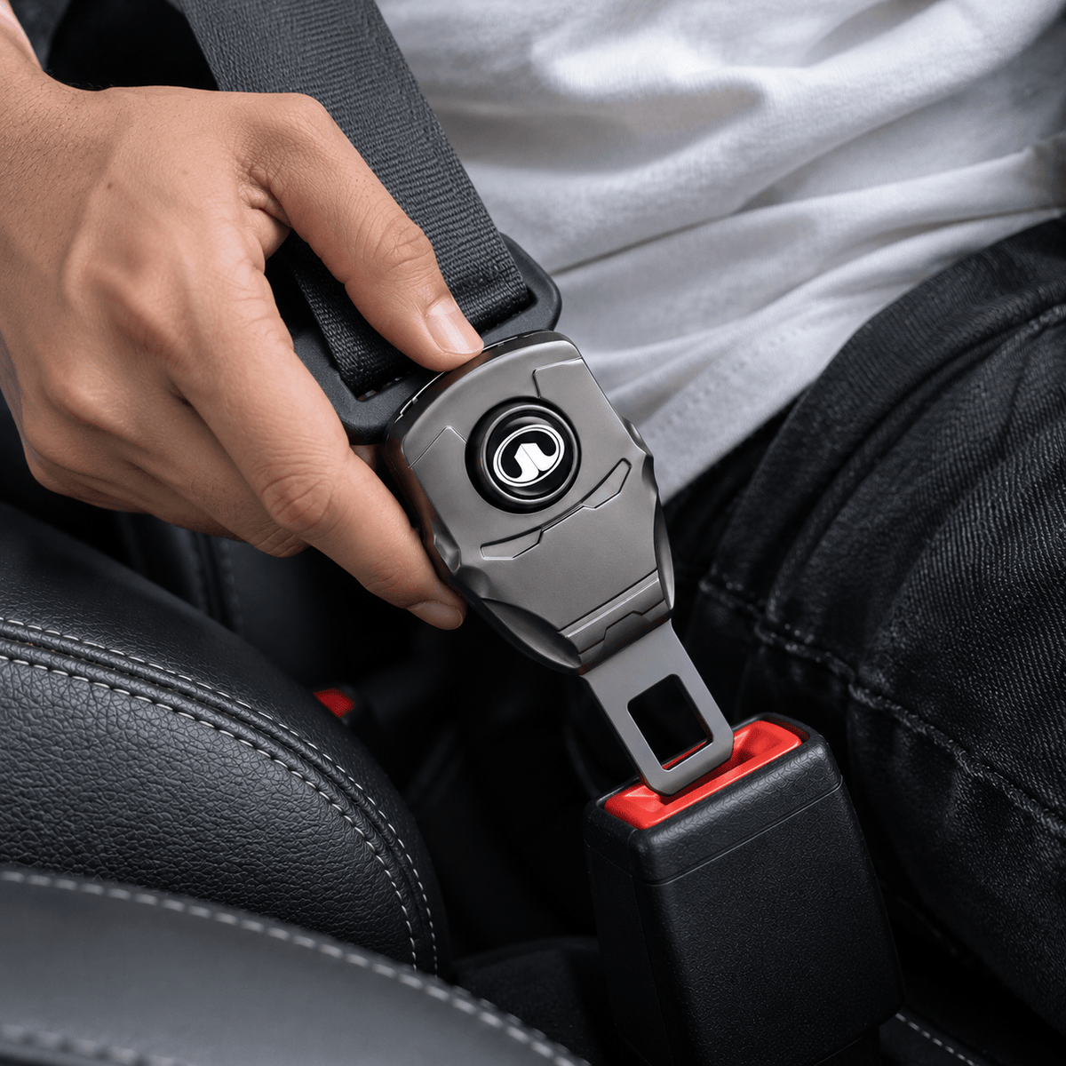 Person installing GWM seat belt buckle extender with seat belt attached