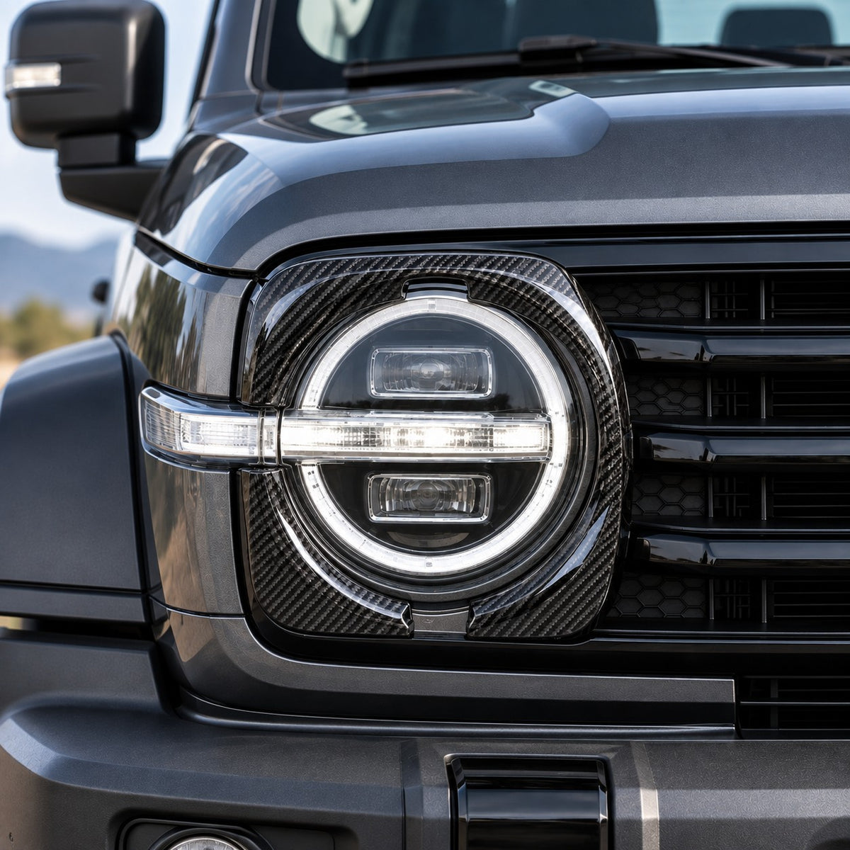GWM Tank 300 with glossy black headlight eyebrow frame cover installed around the front headlight