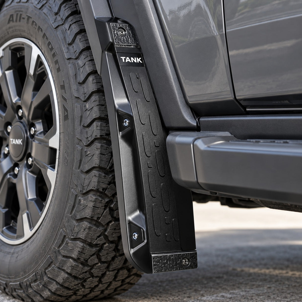 GWM TANK 300 Urban Edition rear mud flap installed beside the front wheel showing close-up fitment and protection