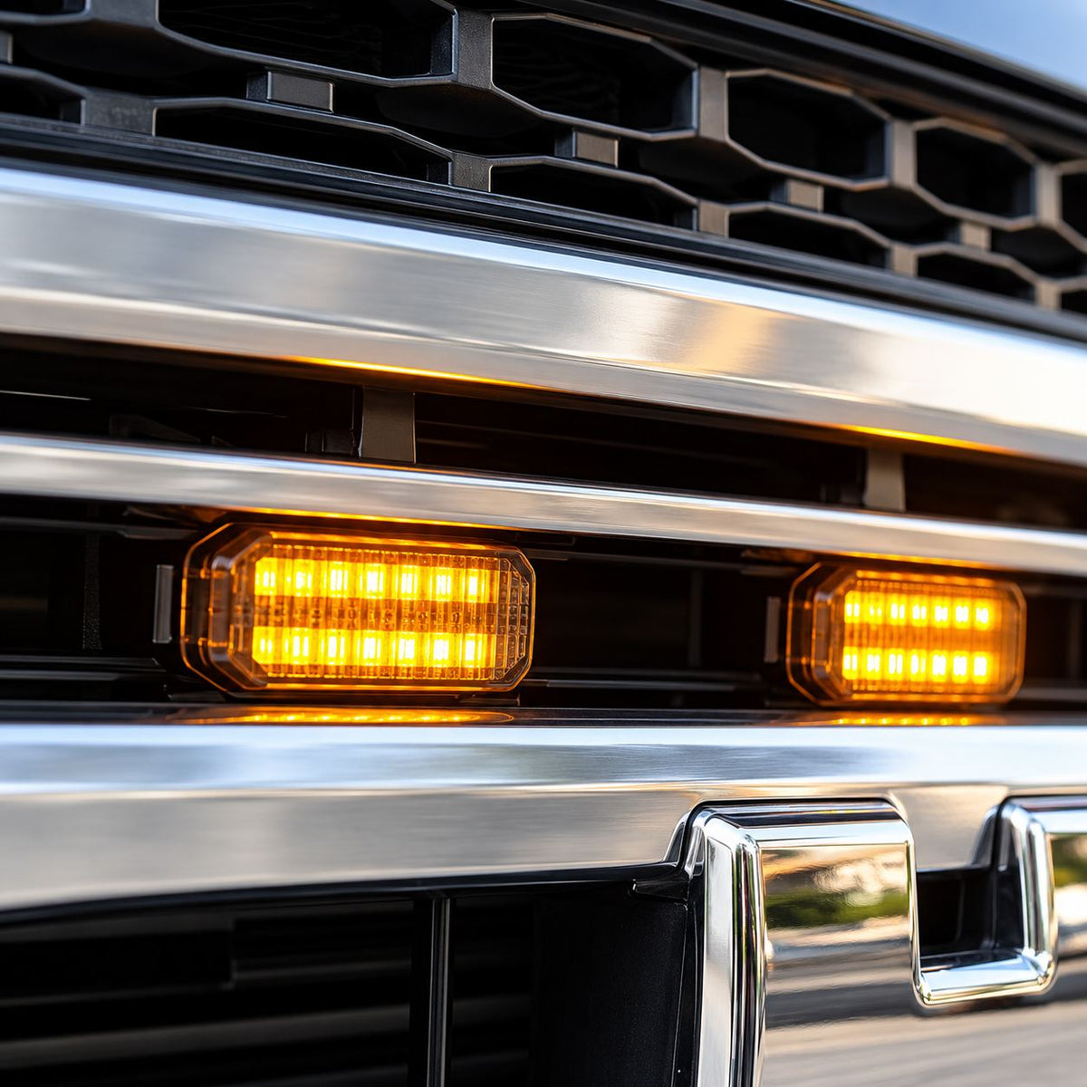 Close-up of illuminated yellow LED lights installed inside Haval H9 grille